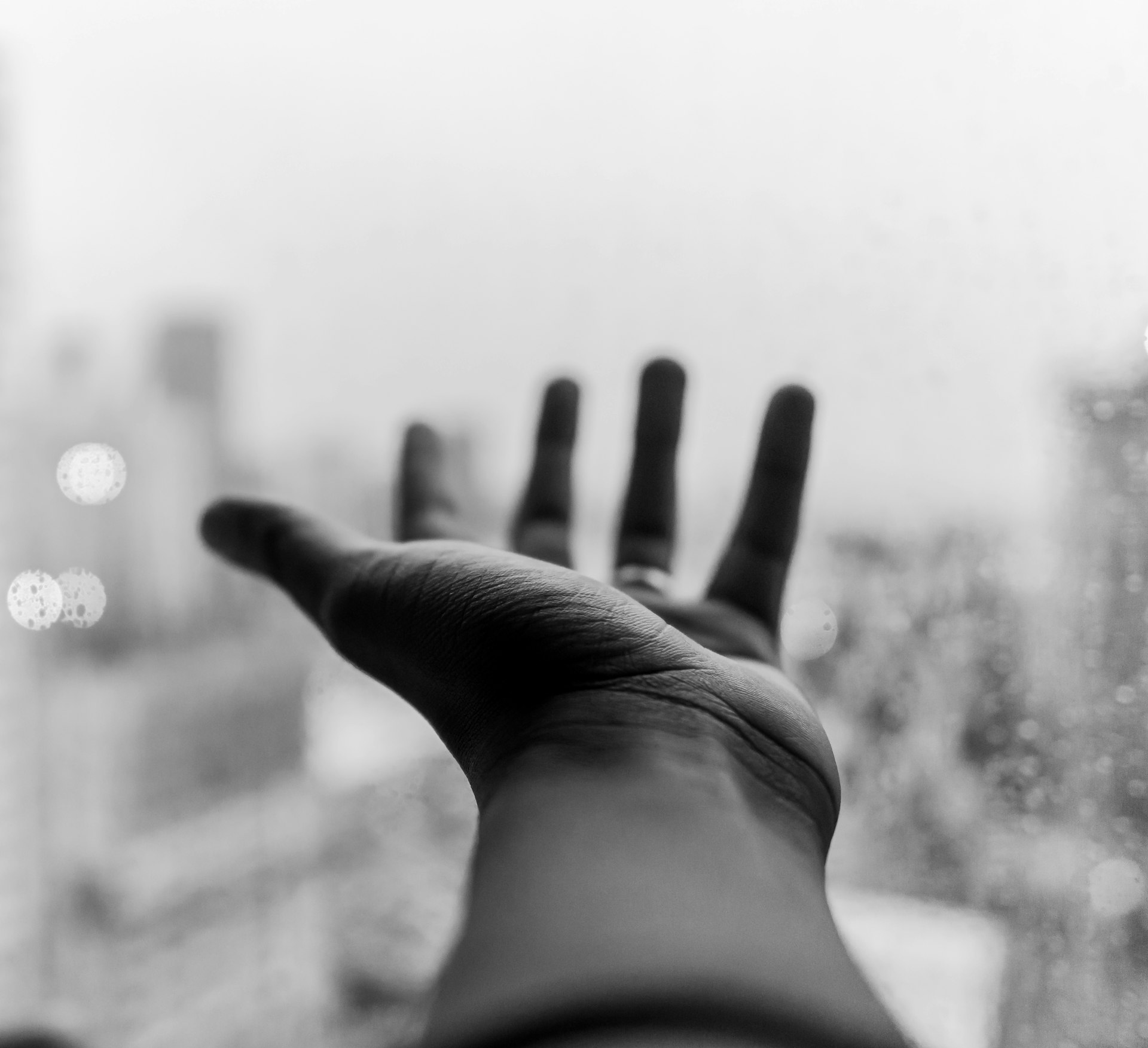 grayscale photo of left person's hand